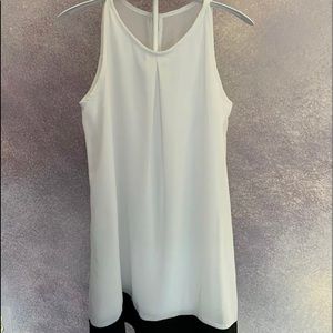 Girl’s sleeveless white dress with black stripe